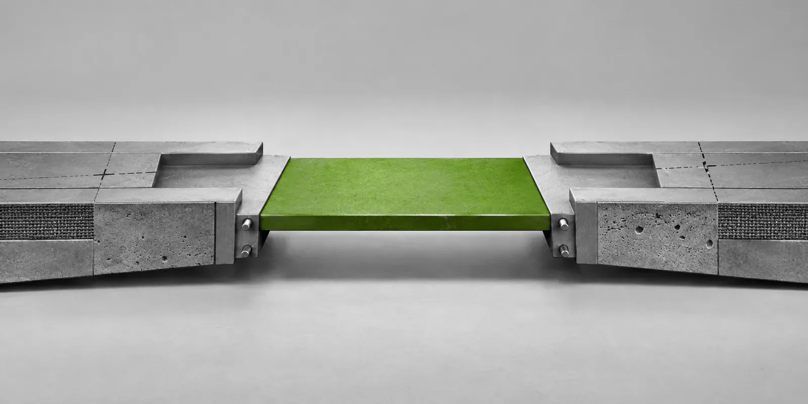 Dos módulos grises convergen en una única superficie de trabajo verde.